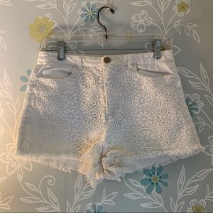 White high-waisted shorts, frilled ends